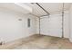 Attached garage with an automatic door and clean flooring at 3735 Kalamath St # 3, Denver, CO 80211