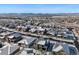 Snow-covered homes in a neighborhood with mountain views at 16382 Spanish Peak Way, Broomfield, CO 80023