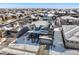 Two-story house with snow covered roof, aerial view at 16382 Spanish Peak Way, Broomfield, CO 80023