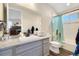 Bathroom with a bathtub, toilet and vanity with granite countertop at 16382 Spanish Peak Way, Broomfield, CO 80023