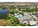 Aerial view of community pool, clubhouse, and lake at 16382 Spanish Peak Way, Broomfield, CO 80023