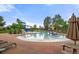 Relaxing community pool with water slides and lounge chairs at 16382 Spanish Peak Way, Broomfield, CO 80023