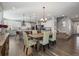 Kitchen and dining area with hardwood floors and farmhouse style table at 16382 Spanish Peak Way, Broomfield, CO 80023