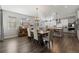 Bright kitchen with an island, stainless steel appliances, and hardwood floors at 16382 Spanish Peak Way, Broomfield, CO 80023