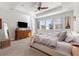 Spacious main bedroom with large bed, dresser, and ceiling fan at 16382 Spanish Peak Way, Broomfield, CO 80023