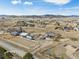 Expansive aerial view of rural property with house, outbuildings, and mountain views at 4900 Beverly Dr, Berthoud, CO 80513