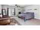 Spacious bedroom with carpeted floors, French doors, and large closet at 4900 Beverly Dr, Berthoud, CO 80513