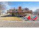 Back exterior of home with deck, patio, and firepit at 4900 Beverly Dr, Berthoud, CO 80513