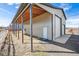 Large outbuilding with a covered area, providing versatile storage and workspace at 4900 Beverly Dr, Berthoud, CO 80513