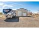 Spacious outbuilding with RV parking, offering ample storage and functionality at 4900 Beverly Dr, Berthoud, CO 80513