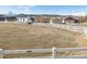 Spacious yard with a white fence, mobile home, and multiple buildings at 4900 Beverly Dr, Berthoud, CO 80513