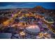 Night aerial view of a town with lights and snow at 3319 Emily St, Castle Rock, CO 80109