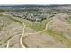 Aerial view of community with winding paths and homes at 3319 Emily St, Castle Rock, CO 80109