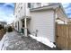 Side yard with concrete patio and wooden fence at 3319 Emily St, Castle Rock, CO 80109