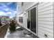 Backyard with patio, sliding glass door, and snowy ground at 3319 Emily St, Castle Rock, CO 80109