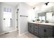 Elegant bathroom with dual vanity sinks and a large mirror at 3319 Emily St, Castle Rock, CO 80109