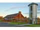 Community clubhouse with rustic barn exterior and silo at 3319 Emily St, Castle Rock, CO 80109