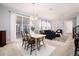 Open concept dining area with table and chairs, adjacent to living room and kitchen at 3319 Emily St, Castle Rock, CO 80109