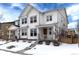 Two-story house with white siding, a gray front door, and a snowy front yard at 3319 Emily St, Castle Rock, CO 80109