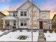 Two-story house with white siding, a brown door, and a snowy front yard at 3319 Emily St, Castle Rock, CO 80109