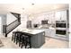 Modern kitchen with gray cabinets, white countertops, and stainless steel appliances at 3319 Emily St, Castle Rock, CO 80109