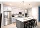 Modern kitchen with stainless steel appliances and an island at 3319 Emily St, Castle Rock, CO 80109