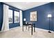 Home office with a desk, chair, and built-in shelving at 3319 Emily St, Castle Rock, CO 80109