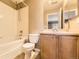 Full bathroom with bathtub, shower, toilet, and vanity with mirror at 17224 Lark Water Ln # D, Parker, CO 80134