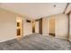 Spacious main bedroom with neutral carpet flooring, ensuite bathroom, and walk-in closet at 17224 Lark Water Ln # D, Parker, CO 80134