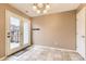 Cozy breakfast nook with tiled floors and glass door to the back at 17224 Lark Water Ln # D, Parker, CO 80134