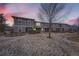 Charming townhomes featuring stone accents and a well-manicured lawn at 17224 Lark Water Ln # D, Parker, CO 80134