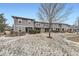 Charming townhomes featuring stone accents and a well-manicured lawn at 17224 Lark Water Ln # D, Parker, CO 80134