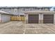Townhome exterior with private garages and fenced patio at 17224 Lark Water Ln # D, Parker, CO 80134