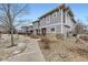 Townhome exterior featuring a sidewalk, stone accents, and low-maintenance landscaping at 17224 Lark Water Ln # D, Parker, CO 80134