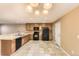 Spacious kitchen with ample counter space, wooden cabinets, and modern appliances at 17224 Lark Water Ln # D, Parker, CO 80134