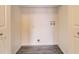 This laundry room features a wire rack, gray wood-look flooring, and neutral walls at 17224 Lark Water Ln # D, Parker, CO 80134