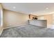 Bright living room with neutral paint, modern lighting, and cozy carpet at 17224 Lark Water Ln # D, Parker, CO 80134