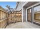 This patio has a wood fence and sliding glass doors at 17224 Lark Water Ln # D, Parker, CO 80134