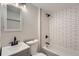 Modern bathroom featuring a subway tile shower, updated sink and hardware, and light walls at 6923 S Albion St, Centennial, CO 80122