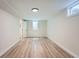Finished bedroom with fresh paint, new flooring, and a bright window at 6923 S Albion St, Centennial, CO 80122