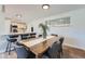 Stylish dining room with a view of the modern, renovated kitchen space at 6923 S Albion St, Centennial, CO 80122