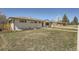 Well-maintained single-story home with a spacious yard and a detached garage at 6923 S Albion St, Centennial, CO 80122