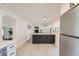 Bright kitchen with an island, stainless steel appliances, and easy access to dining at 6923 S Albion St, Centennial, CO 80122