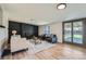 Spacious living room with a cozy black-brick fireplace, plush seating, and sliding doors to the outside at 6923 S Albion St, Centennial, CO 80122