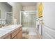 Well-lit bathroom featuring vanity, a shower-over-tub, and tile flooring at 1950 Five Iron Dr, Castle Rock, CO 80104