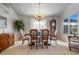 Formal dining room with wooden table, chairs, and chandelier at 1950 Five Iron Dr, Castle Rock, CO 80104