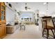 Spacious living room with vaulted ceilings and views of the snowy landscape at 1950 Five Iron Dr, Castle Rock, CO 80104