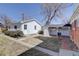 Backyard features include a detached garage, a covered patio, and a brick path at 525 W Midway Blvd, Broomfield, CO 80020