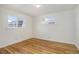 Bedroom with hardwood flooring and a pair of windows at 525 W Midway Blvd, Broomfield, CO 80020