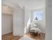 Bright bedroom with hardwood floors, a cozy chair and a sunlit window at 525 W Midway Blvd, Broomfield, CO 80020